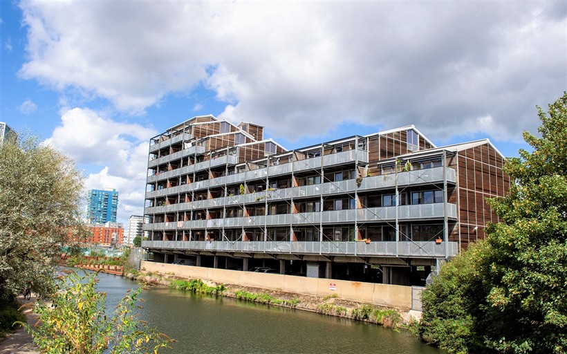 Island House Development viewed from the opposite river bank